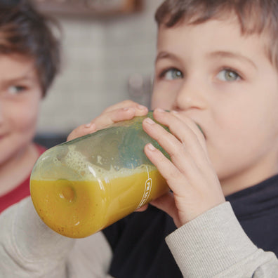 Boy drinking Welly Kids mango passion smoothie
