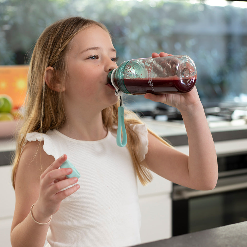 Girl drinking Welly Kids instant smoothie Berry Beets